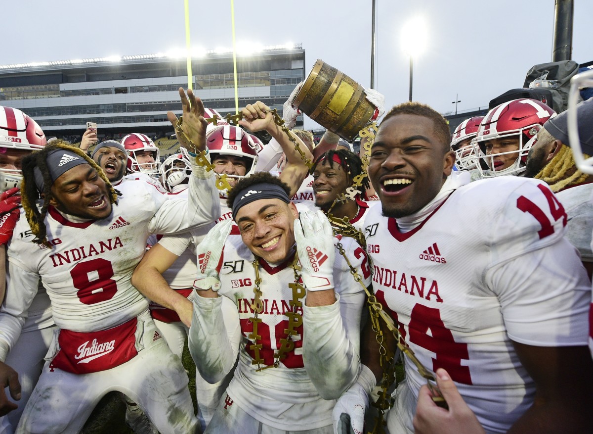 West Lafayette, IN, USA; Indiana Hoosiers players celebrate winning the Old Oaken Bucket by defeating the Purdue Boilermakers, 44-41 in 2 OT at Ross-Ade Stadium. Mandatory Credit: Thomas J. Russo-USA TODAY Sports